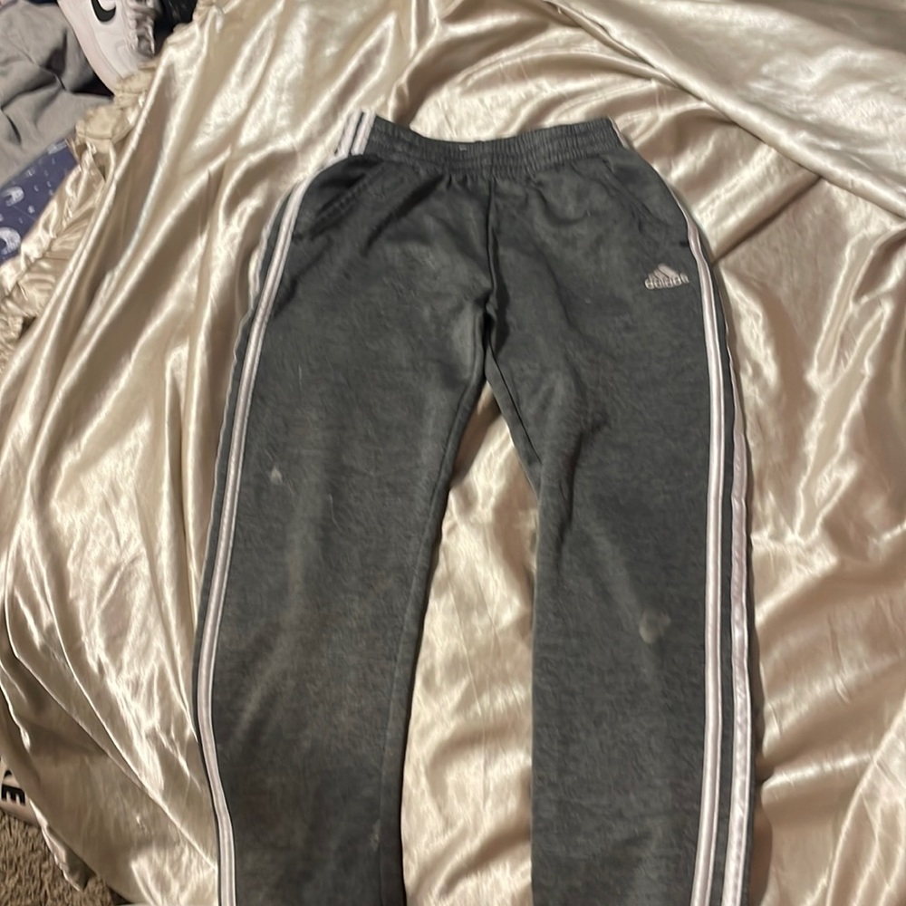 has bleach stains by knees.